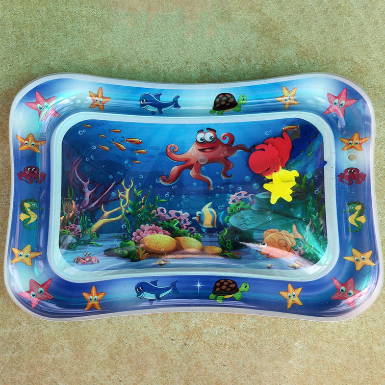 Inflatable water play mat with ocean-themed design on a beige background