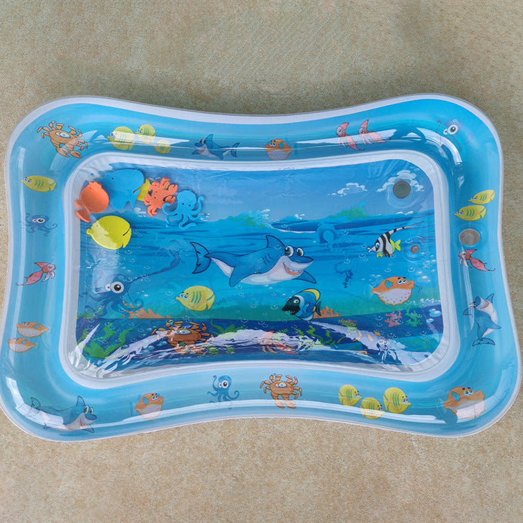 Inflatable water mat with underwater animal design on a beige surface