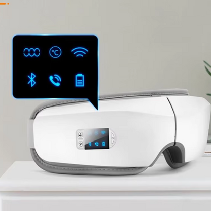 White bluetooth eye massager with digital display on a light gray background